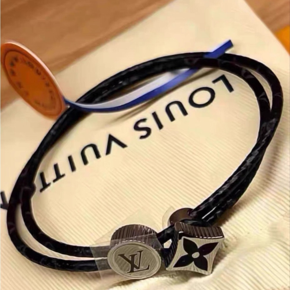 Louis Vuitton engraved Monogram adjustable opening and closing metal bracelet